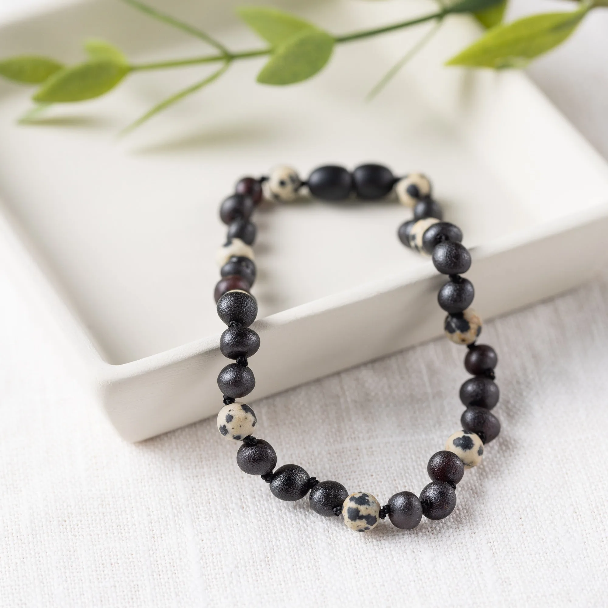 Adults | Dalmatian Jasper   Raw Cherry Amber Anklet