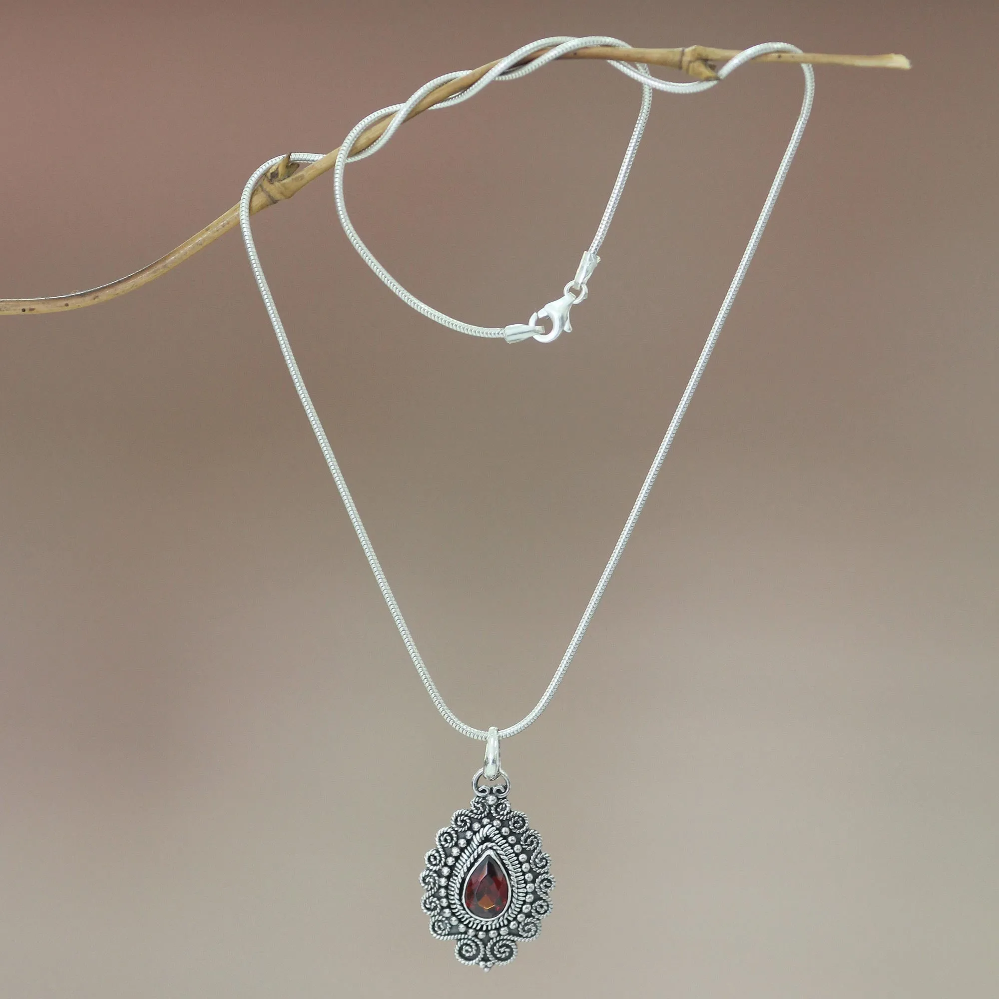Handcrafted Sterling Silver and Garnet Pendant Necklace - Queen of Bali | NOVICA